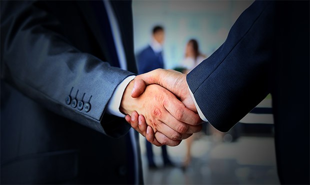 Two businessman shaking hands