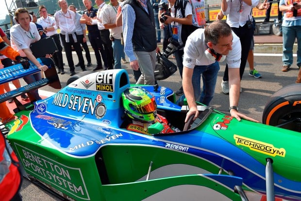 Mick Schumacher, German racing driver and son of seven-time Formula One champion Michael Schumacher, sits inside a Benetton B194 car before driving demonstration laps on the occasion of Michael Schumacher's 25th first Formula One victory, at the Spa-Francorchamps circuit in Spa on August 27, 2017, ahead of the Belgian Formula One Grand Prix. / AFP PHOTO / LOIC VENANCE